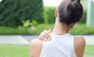 A women holding her shoulders and neck