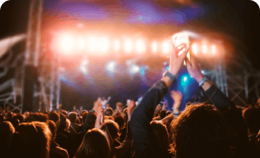 A crowd cheering at a concert