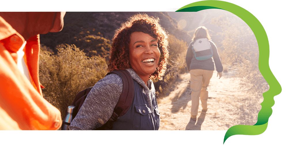 Woman smiles while hiking