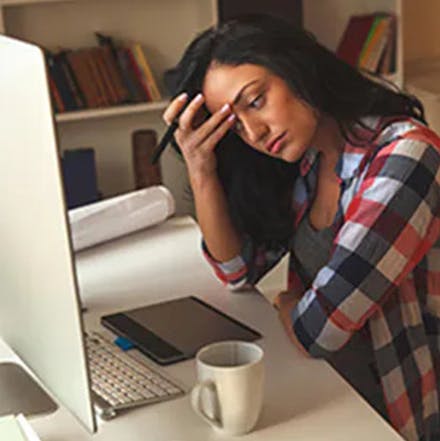 a women with eye strain at computer