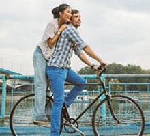 man and women on a bike 