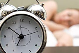 alarm clock and person sleeping