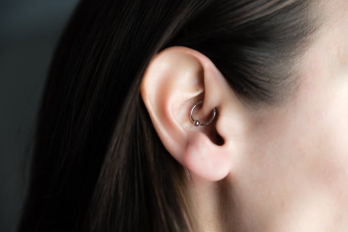 Earring in store ear for migraine