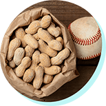 a brown bag of peanuts with a baseball next to it