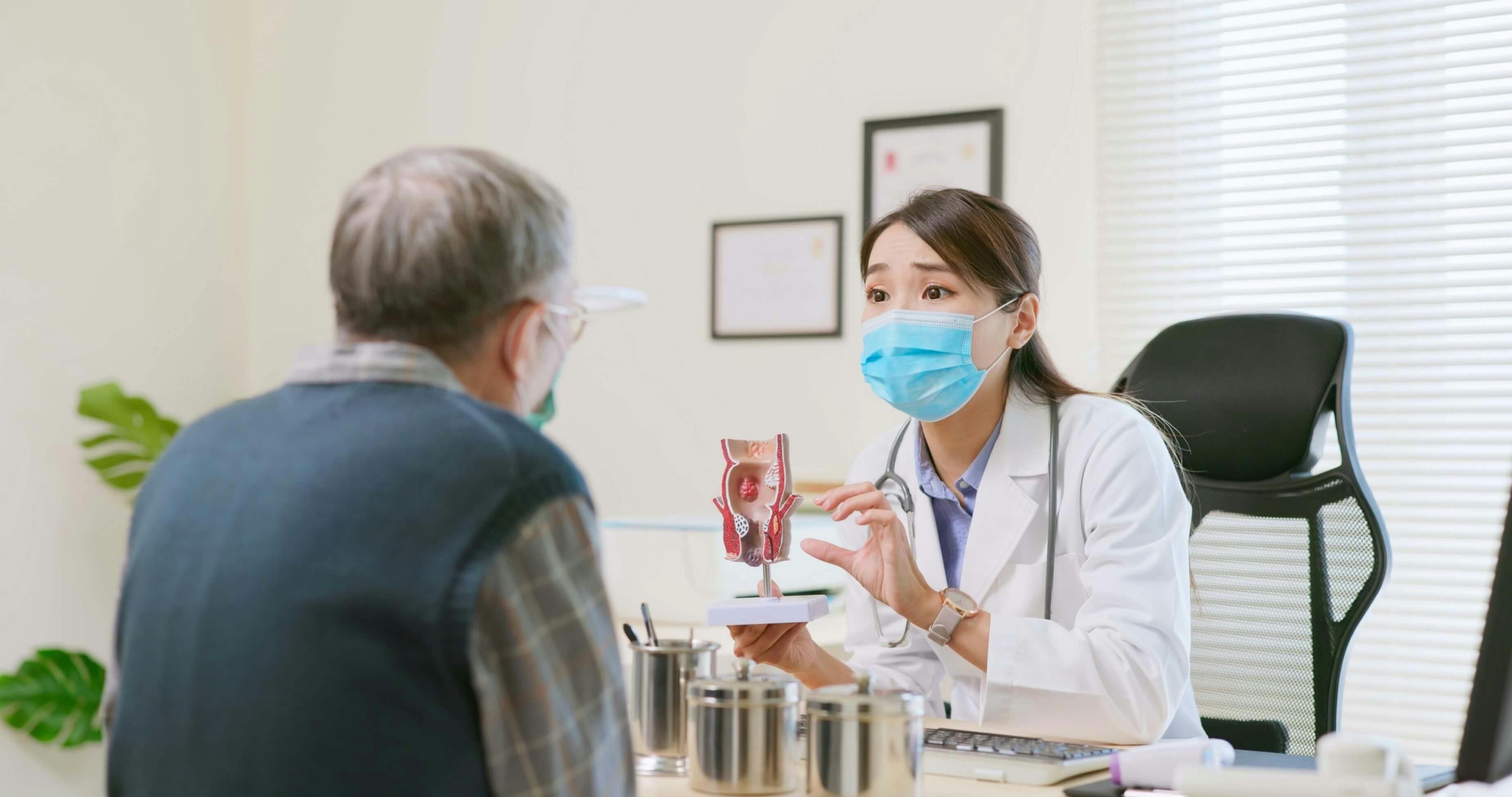 Doctor showing diagram to patient Doctor showing diagram to patient