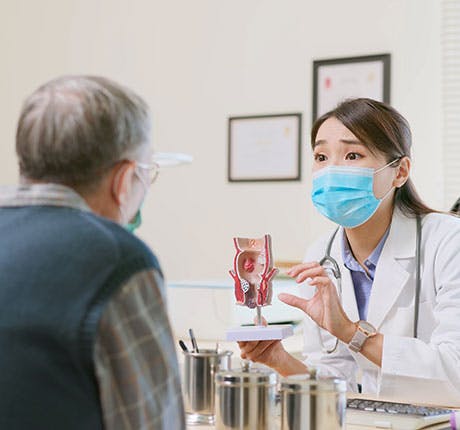 Doctor showing diagram to patient Doctor showing diagram to patient