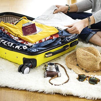 Person packing suitcase
