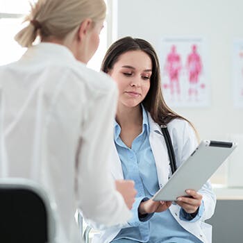 Doctor showing patient notes