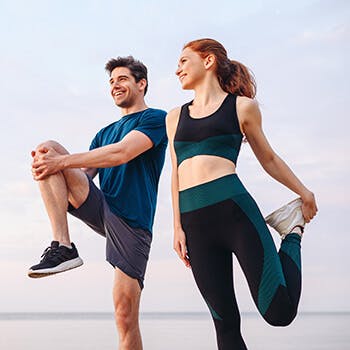Man & woman stretching Man & woman stretching