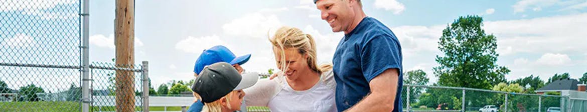 allergy free baseball family hugging outside