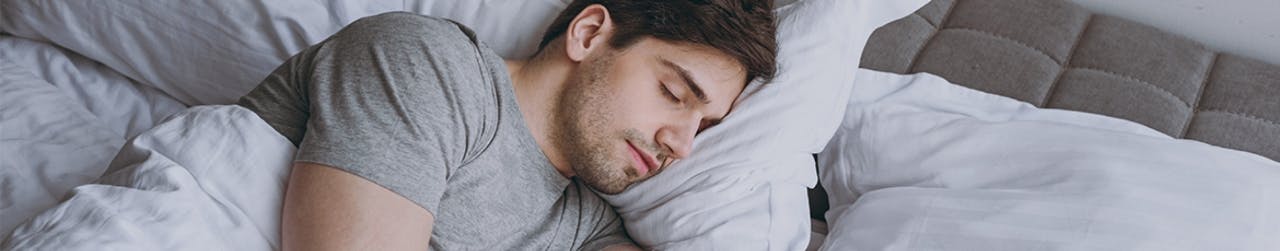 Man in bed sleeping peacefully