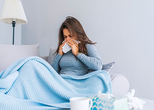 Woman sick with a cold