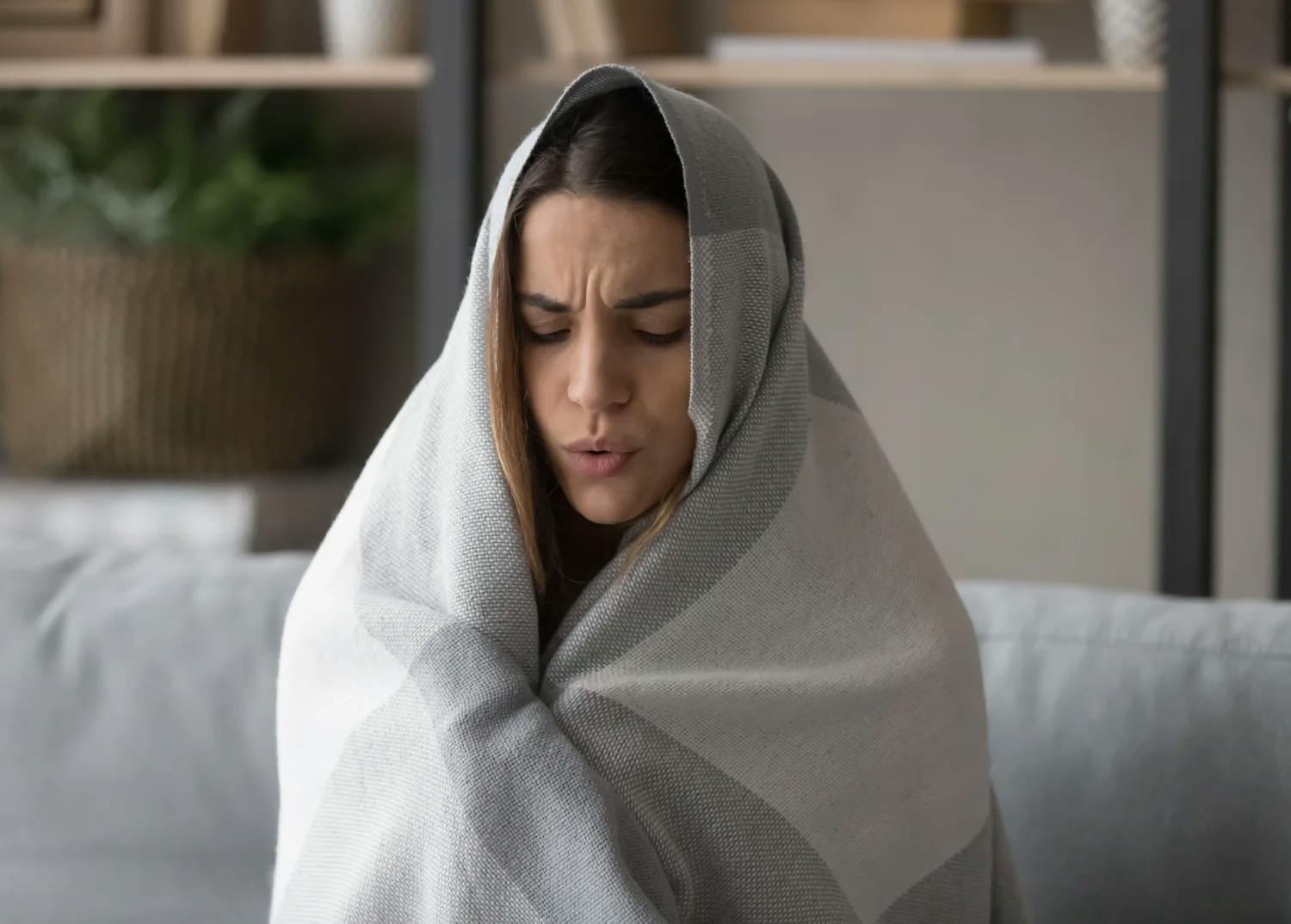 Woman wrapped in blanket.