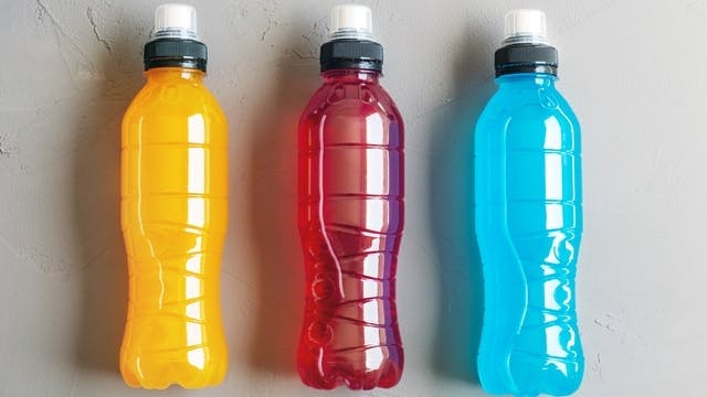 Three bottles of colored water Three bottles of colored water