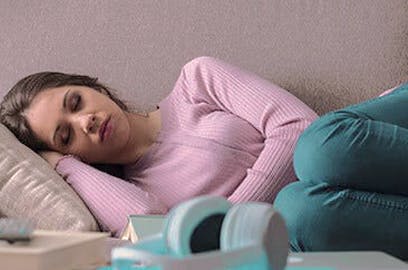 Woman napping on couch