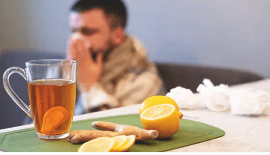 Man with a cold blowing nose into a tissue 