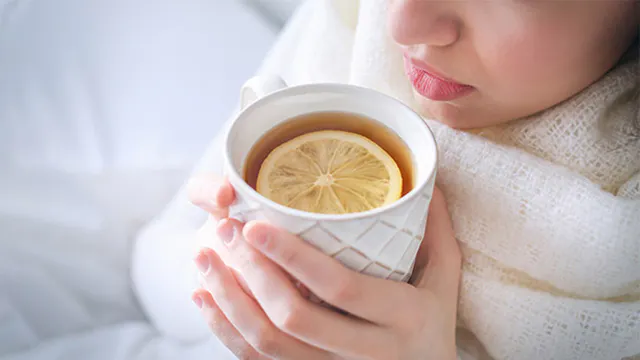 Woman drinking hot tea