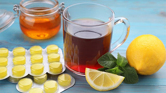 Cough and cold remedies shown together, including yellow cough drops