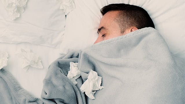 Man with cold or flu sleeping peacefully