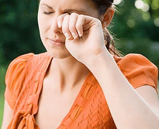 Person rubbing eyes Person rubbing eyes