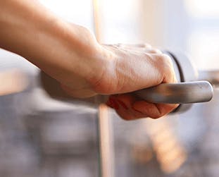 Person touching doornknob Person touching doornknob