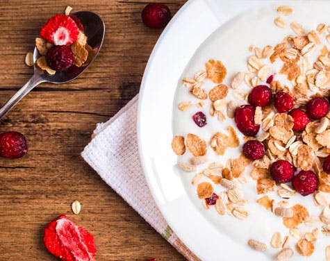 bowl of granola and fruits with yogurt