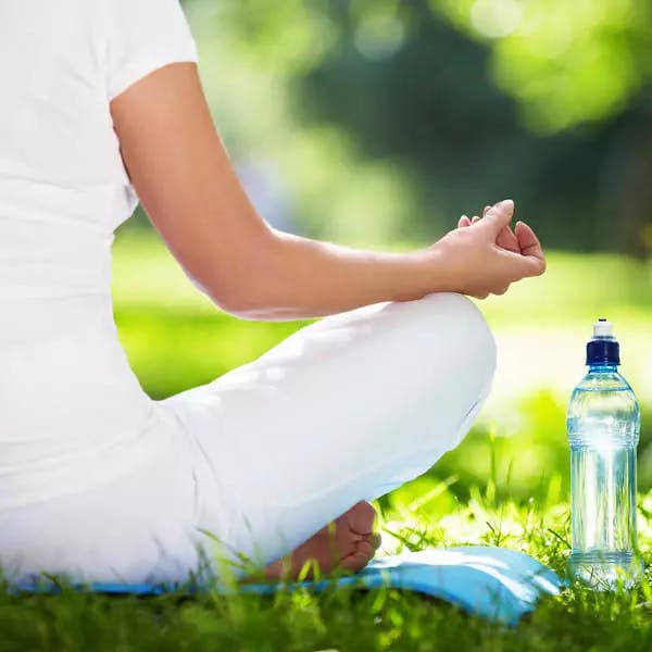 Close up of woman in lotus position