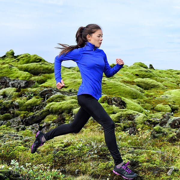 Woman running on a mountain