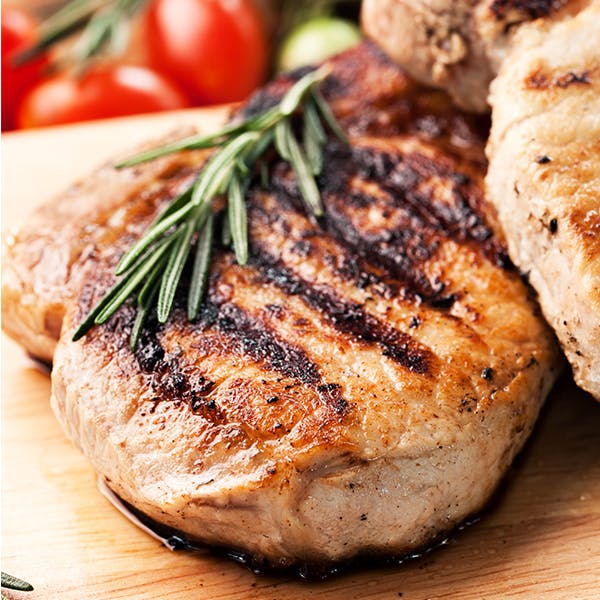 A close up of cooked pork chops.