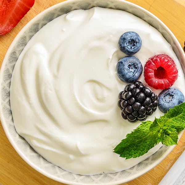 A bowl of plain low-fat yoghurt.