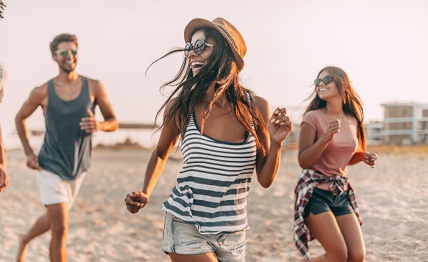 Adults dancing on the beach