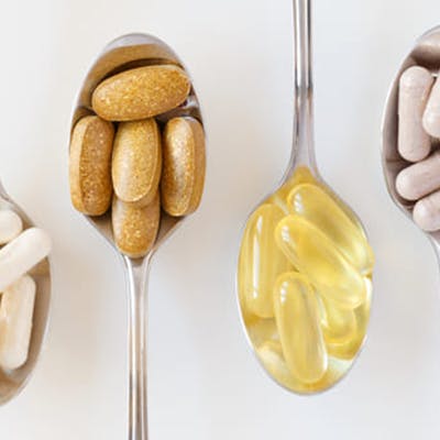 Spoons holding pills.