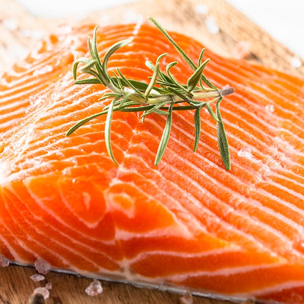 Fresh salmon being prepared.