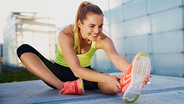 healthy young woman stretching