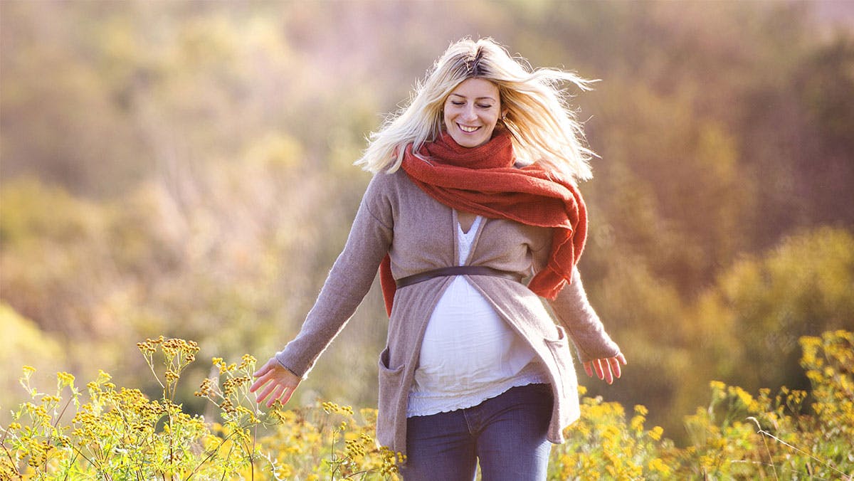 pregnany woman walking in nature