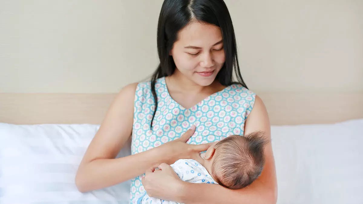 Woman breastfeeding her child