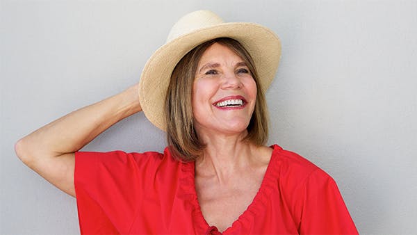 Healthy middle-aged woman laughing 