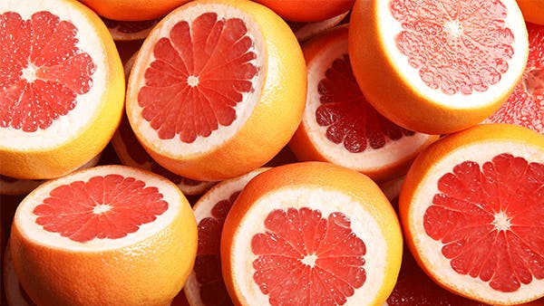 freshly cut grapefruit image