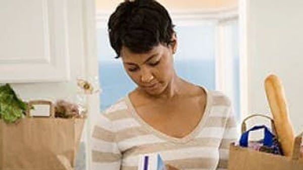 woman with grocery shopping bags