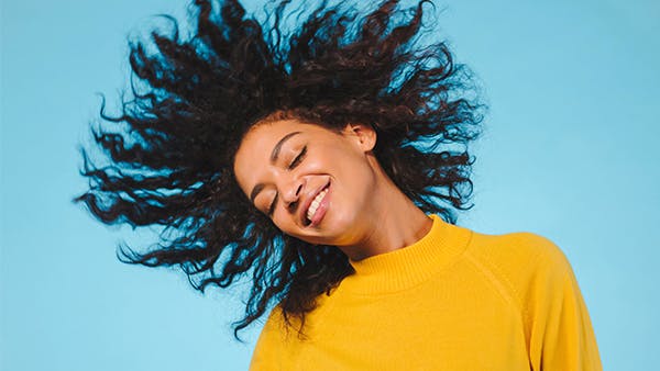 young woman tossing hair