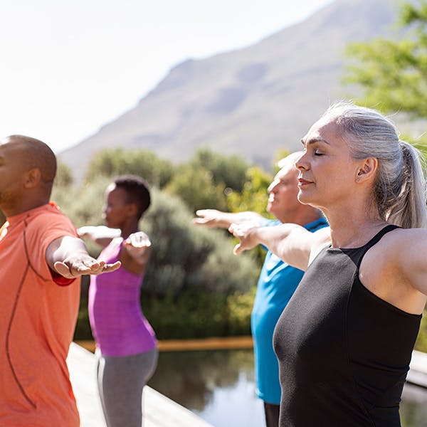 Group of people stretching outdoors