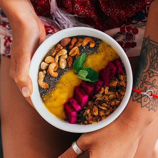 Woman holding acai bowl