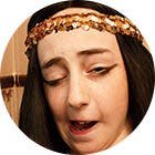 A young girl, inspired by King Tut, takes Buckley’s. She makes a strange face after because of the taste.