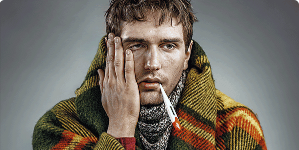 Man with flu symptoms taking his temperature