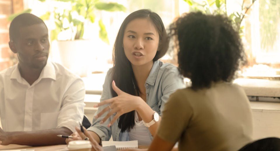 three people talking