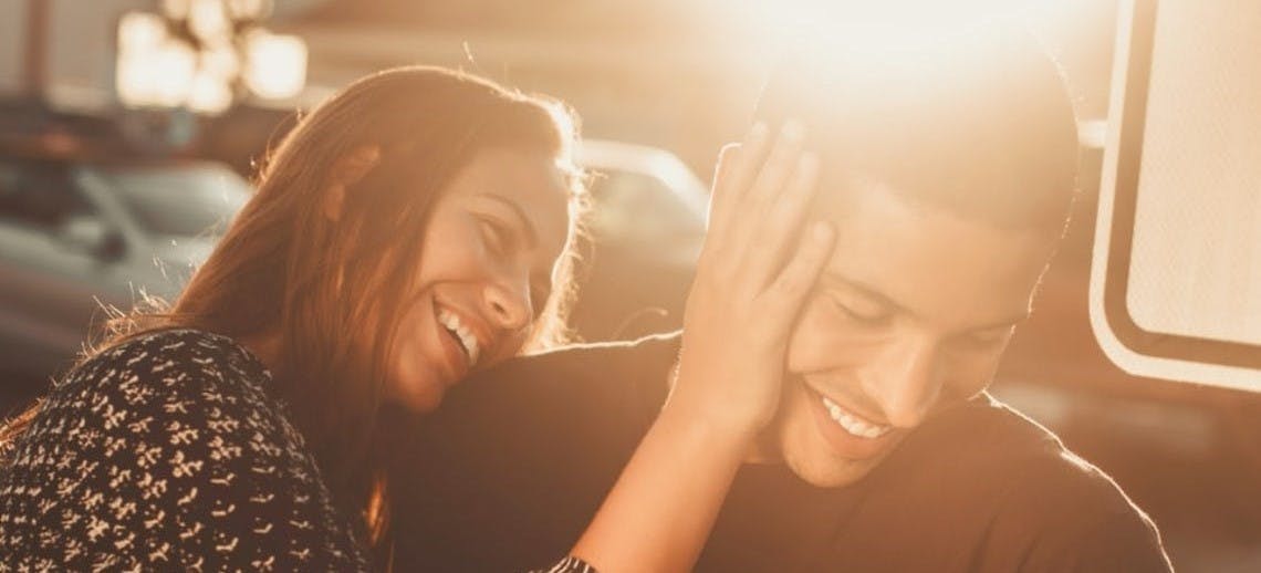 A women touching a mans face