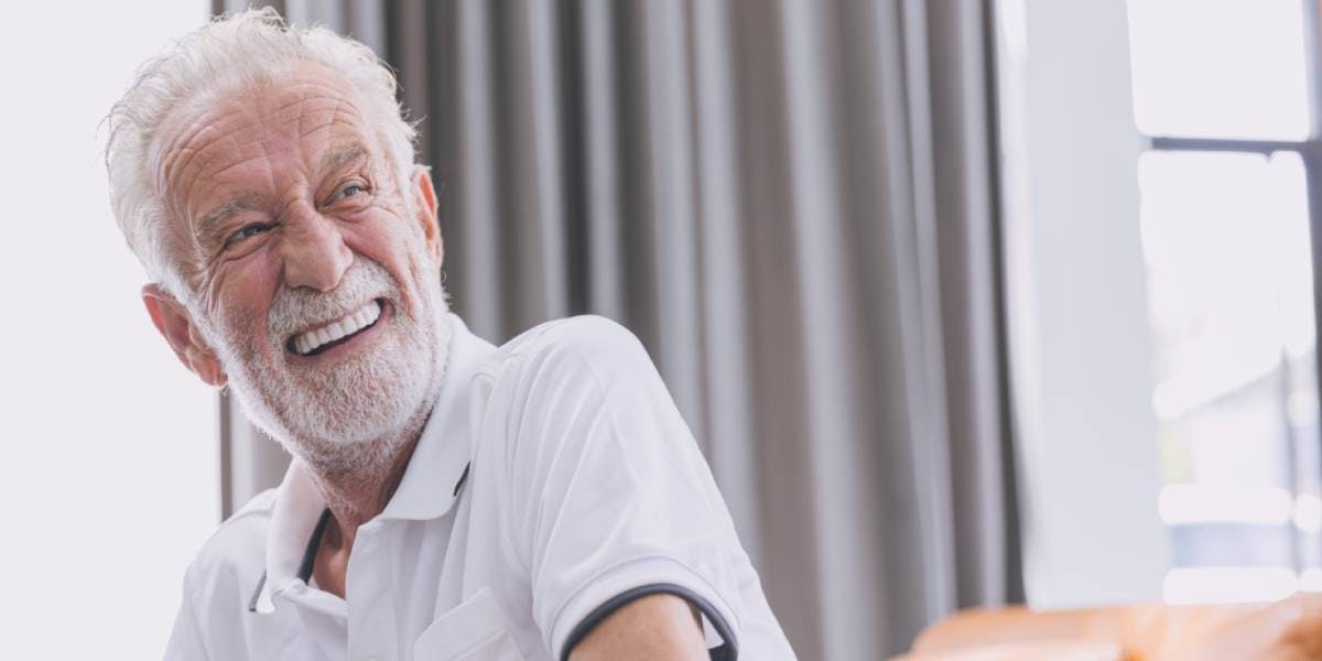 Smiling older man wearing dentures