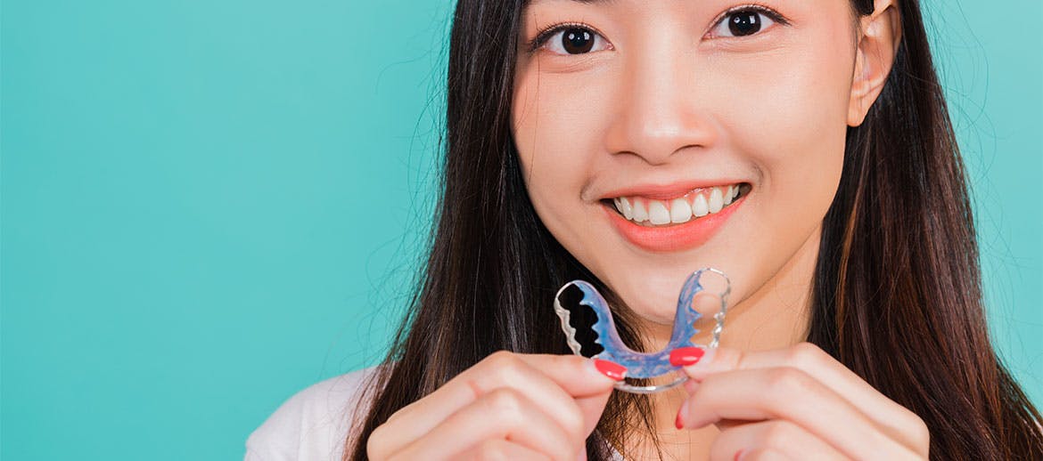 woman holding retainer
