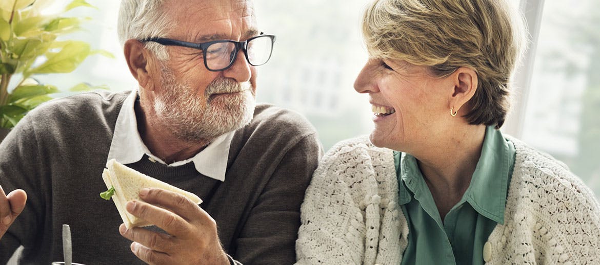 Older couple eats together