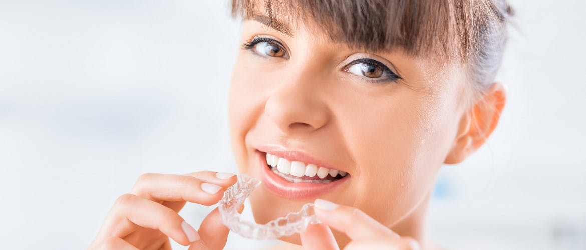 woman putting her retainer